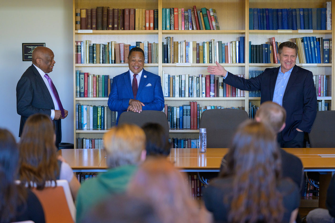 Ken Miller, director of Rose Institute, introducing Willie Brown and Vernon Grigg.