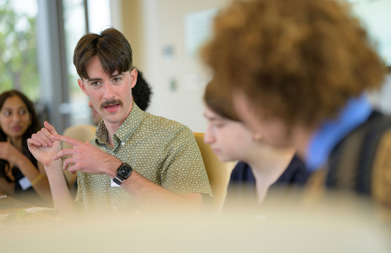 Students of the Rose Institute, with Nolan Windham'25, at the center attending the Board of Governors luncheon.