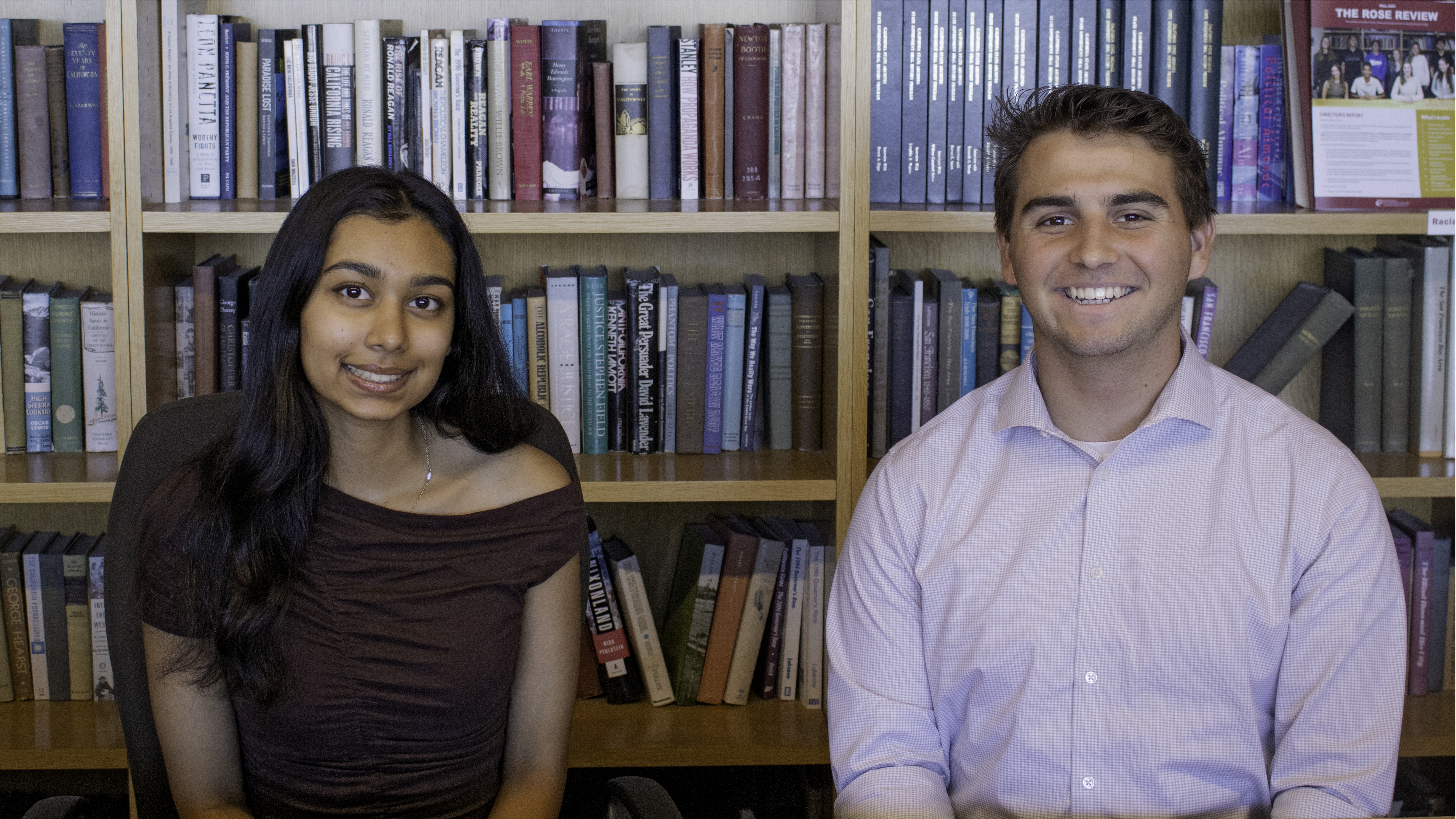 Aria Fafat and Kevin Bender in front of books